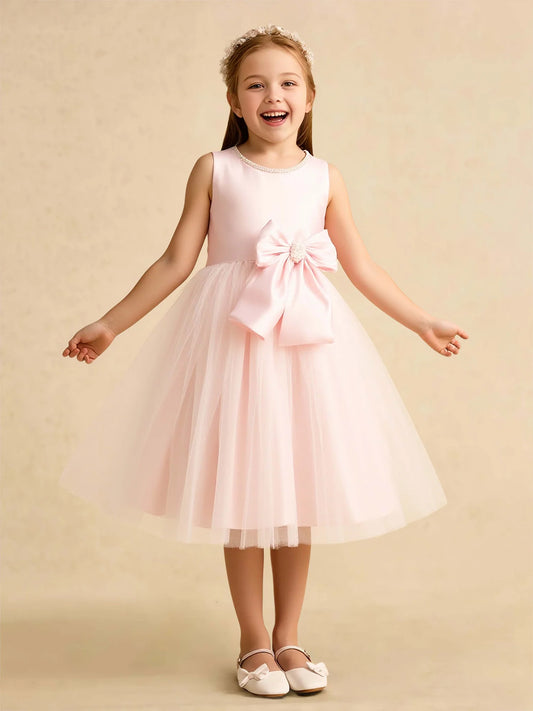 Heowos blush pink flower girl dress with jeweled neckline, large waist bow, and layered tea-length tulle skirt
