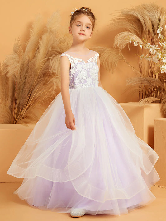 Heowos lavender flower girl dress with white floral lace, a round illusion neckline, cap sleeves and a cascading tulle skirt.