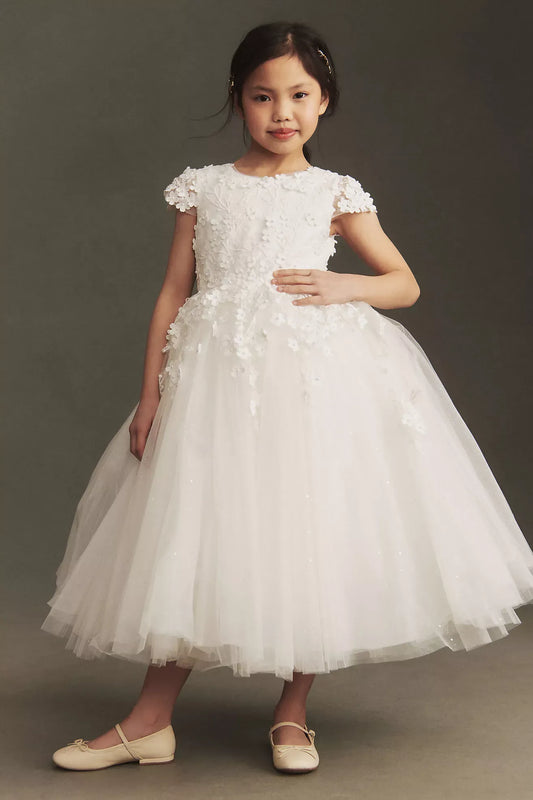 Heowos white first communion ballgown with a round neckline, 3D floral cap sleeves and a sparkling tea-length tulle skirt.