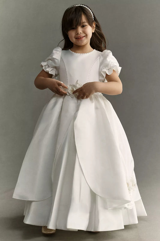 Heowos white first communion ballgown with ruffled puff sleeves, beaded bodice trim, floral waist accents and a split-front overskirt.