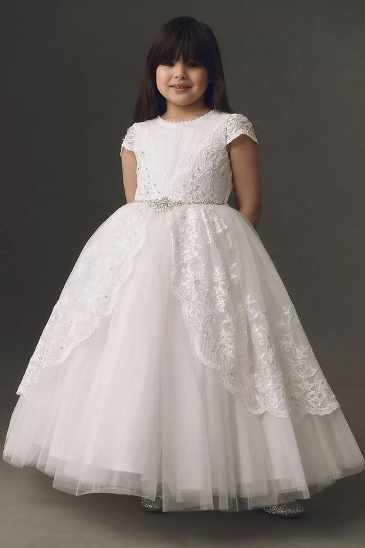 Heowos white first communion ballgown with lace cap sleeves, an illusion neckline, jeweled waist and scalloped lace over tulle.